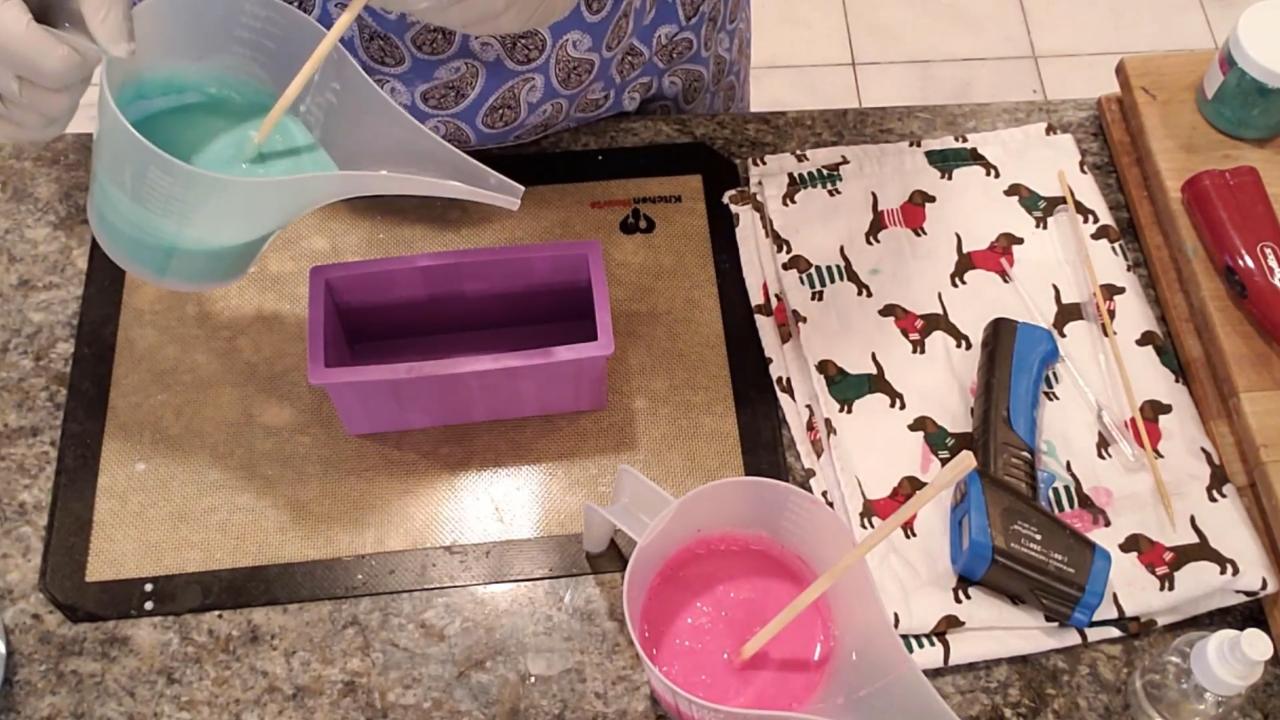 Pouring green soap into a small loaf mold