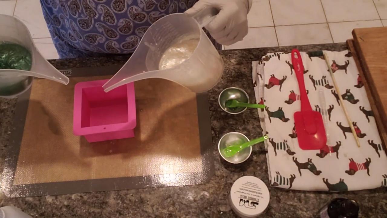 Pouring pearl and green soap into a square mold