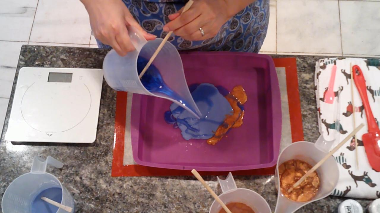 Pouring amber soap over the blue