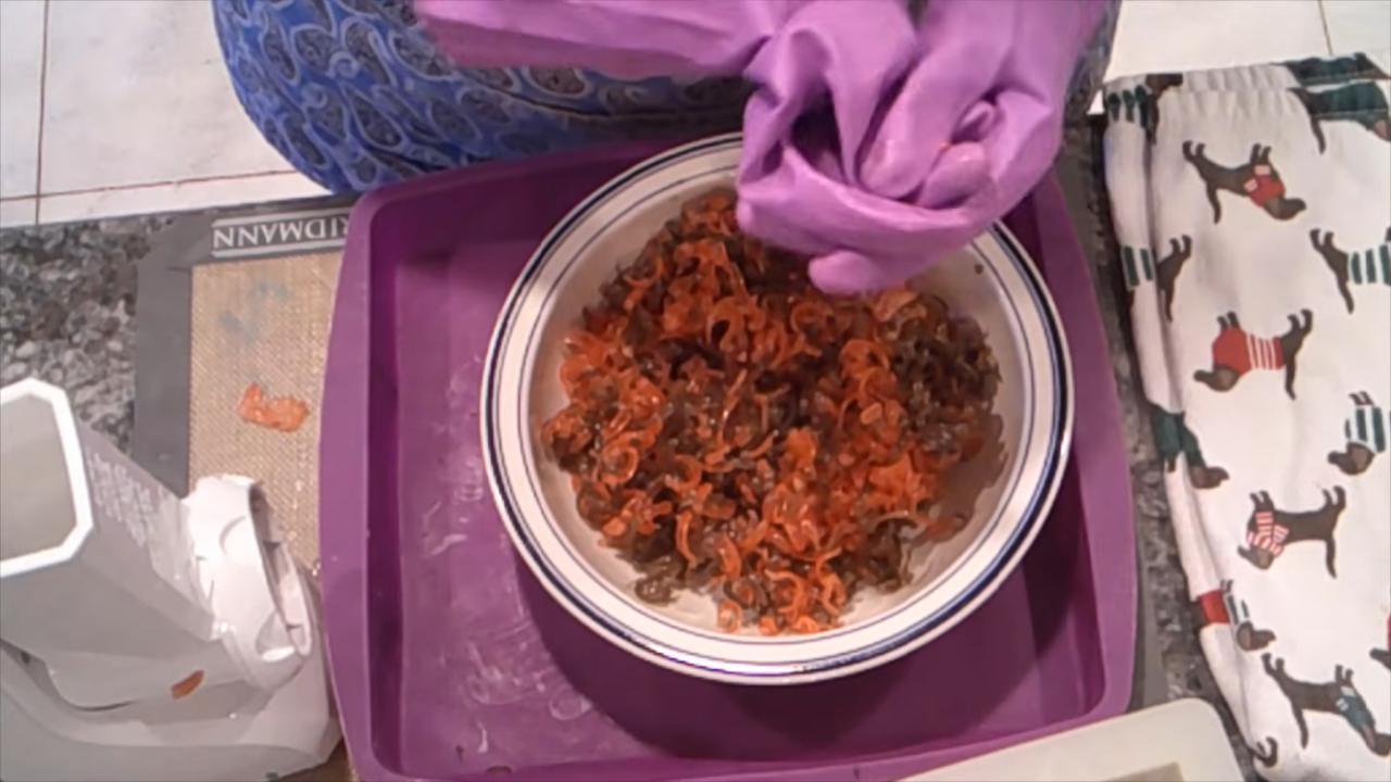 Bowl of red and brown soap confetti
