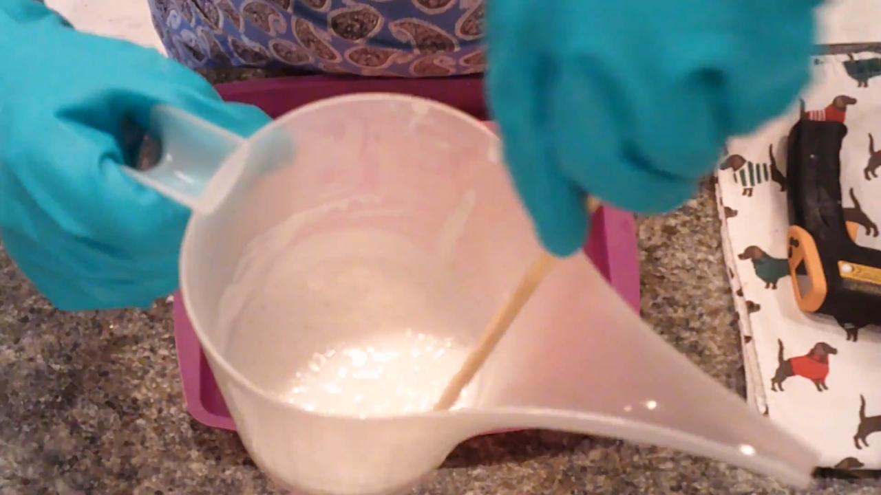 Pouring remelted whipped soap into a cavity mold