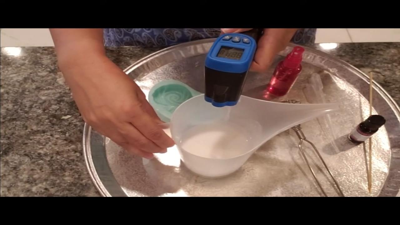 Checking the temperature of melted goat milk soap