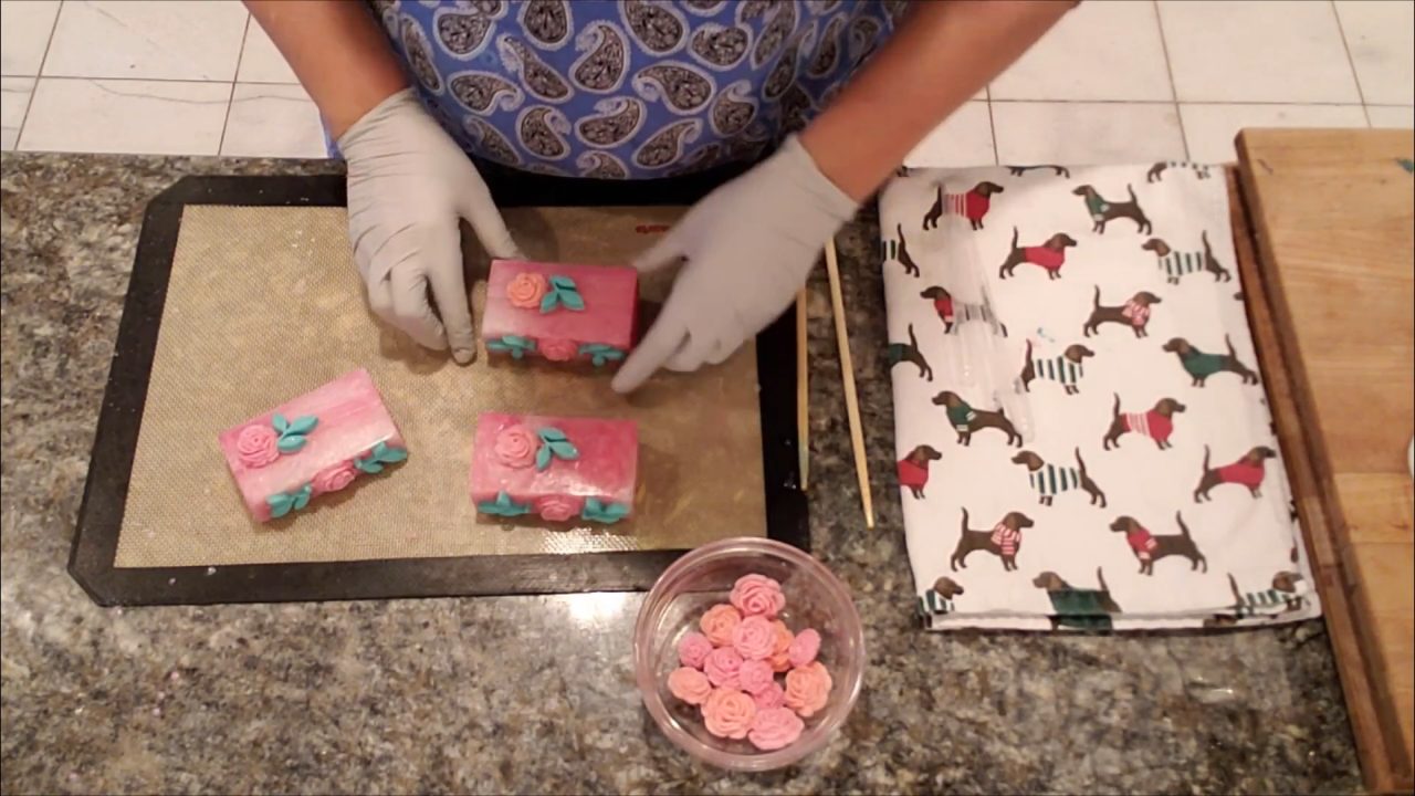 Finished blooming roses melt and pour soap bars with rose and leaf embeds