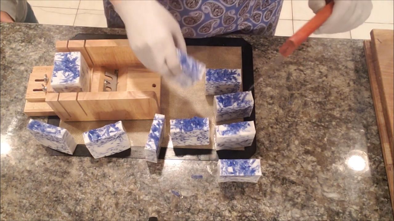 Finished blue confetti soap bars lined up after cutting
