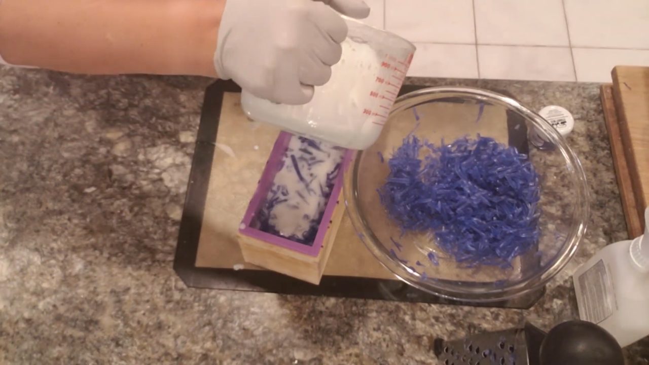 Layering blue shreds and white soap in the loaf mold