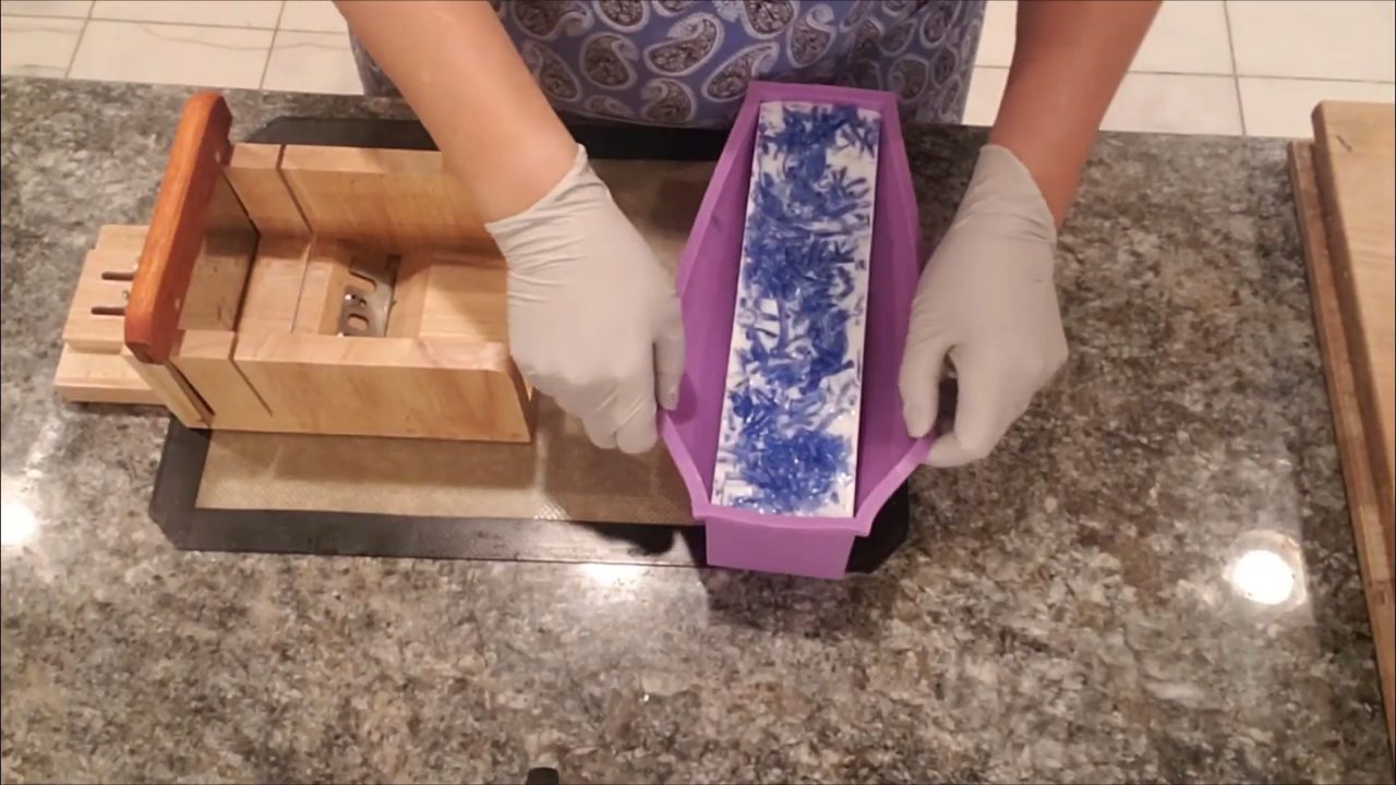 Unmolding the blue confetti soap loaf