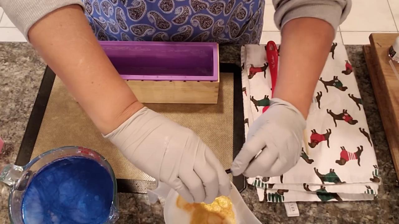 Blue and gold soap cooling in pour cups