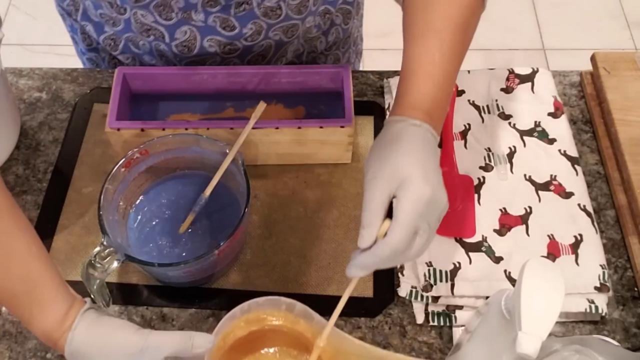 Pouring gold soap over the blue layer