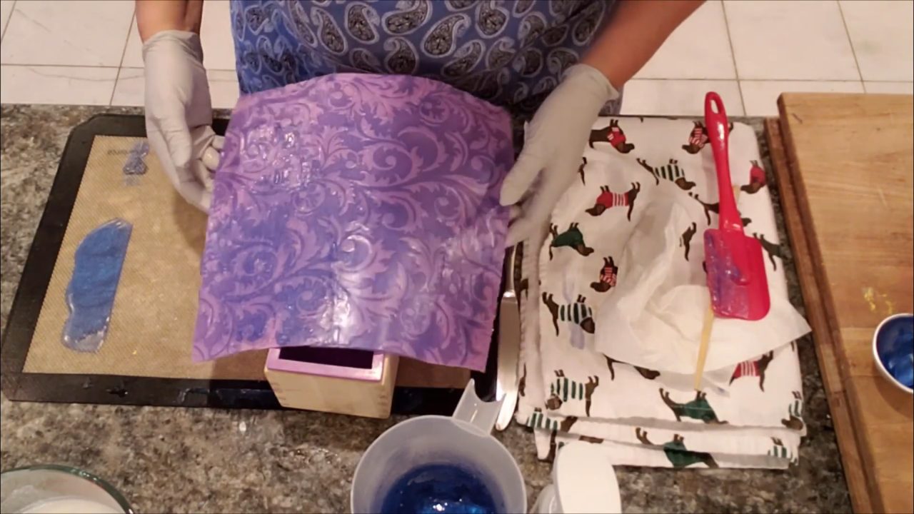 Impression mat with blue soap folded into a loaf mold
