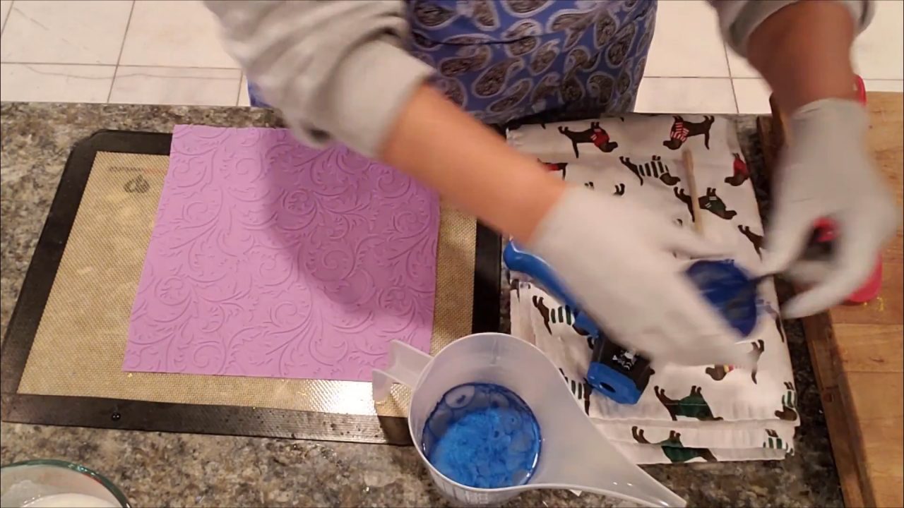 Stirring blue mica into melted clear melt and pour soap