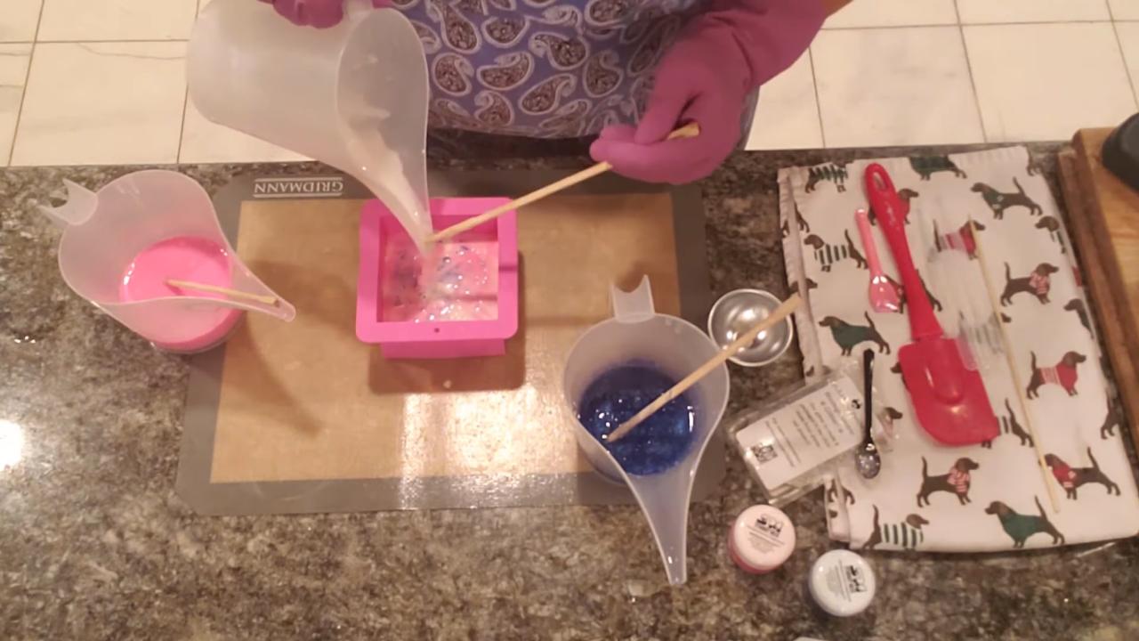 Alternating pours of pink, white and blue soap