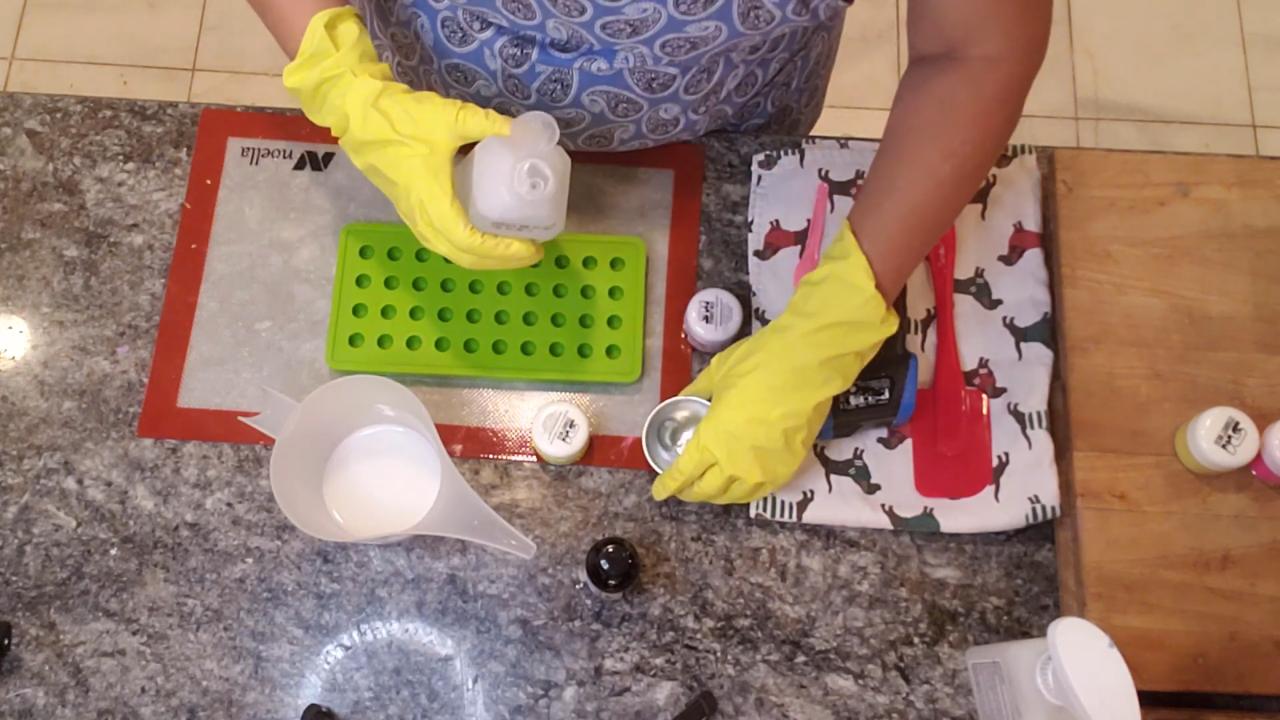Mixing neon yellow mica into melted shea butter soap