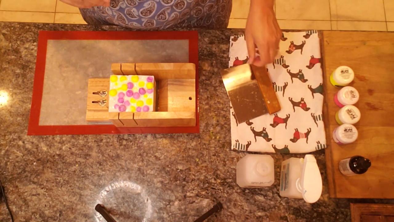 Unmolded Bubble Grape soap loaf in the cutter