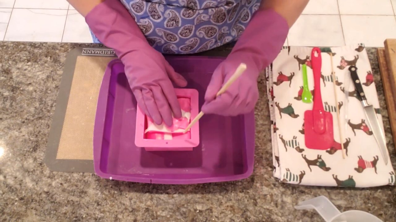 Poking holes between the rolled soap with a chopstick