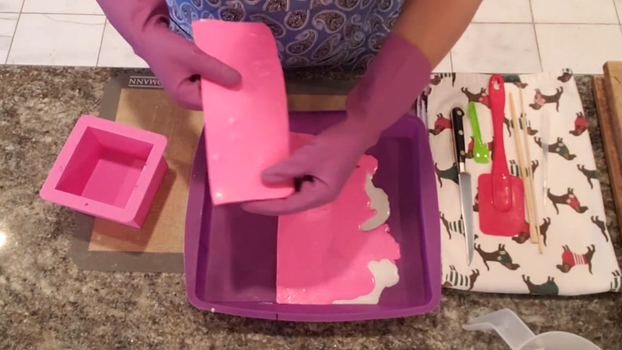 Rolling a strip of layered soap like a jelly roll