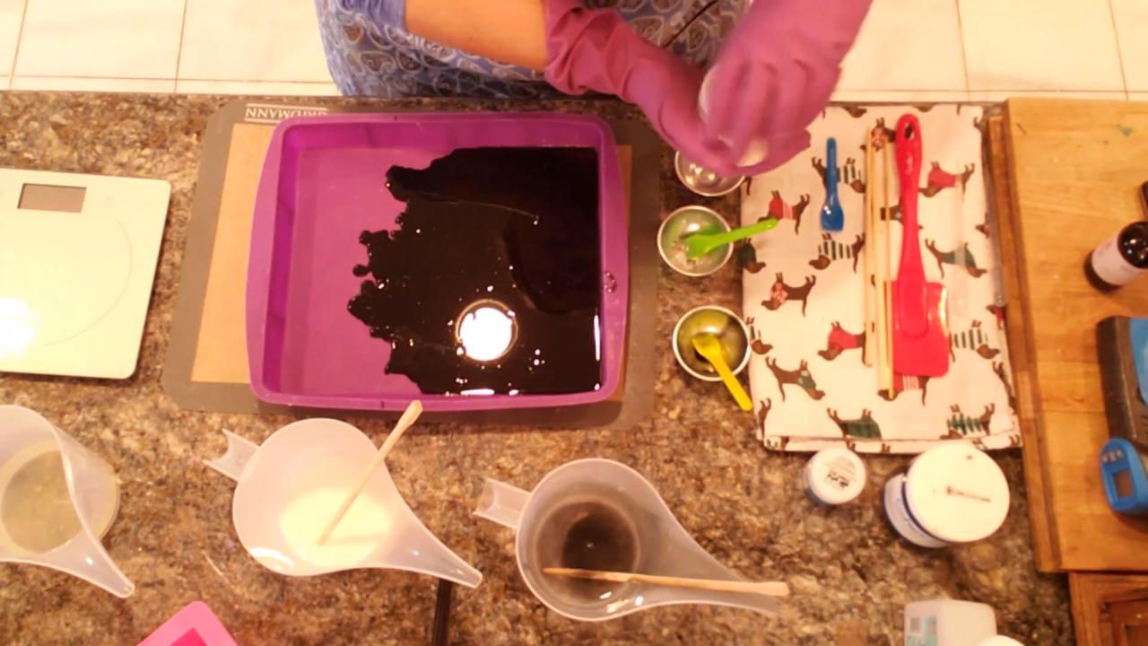 Black charcoal soap layer poured in a silicone pan