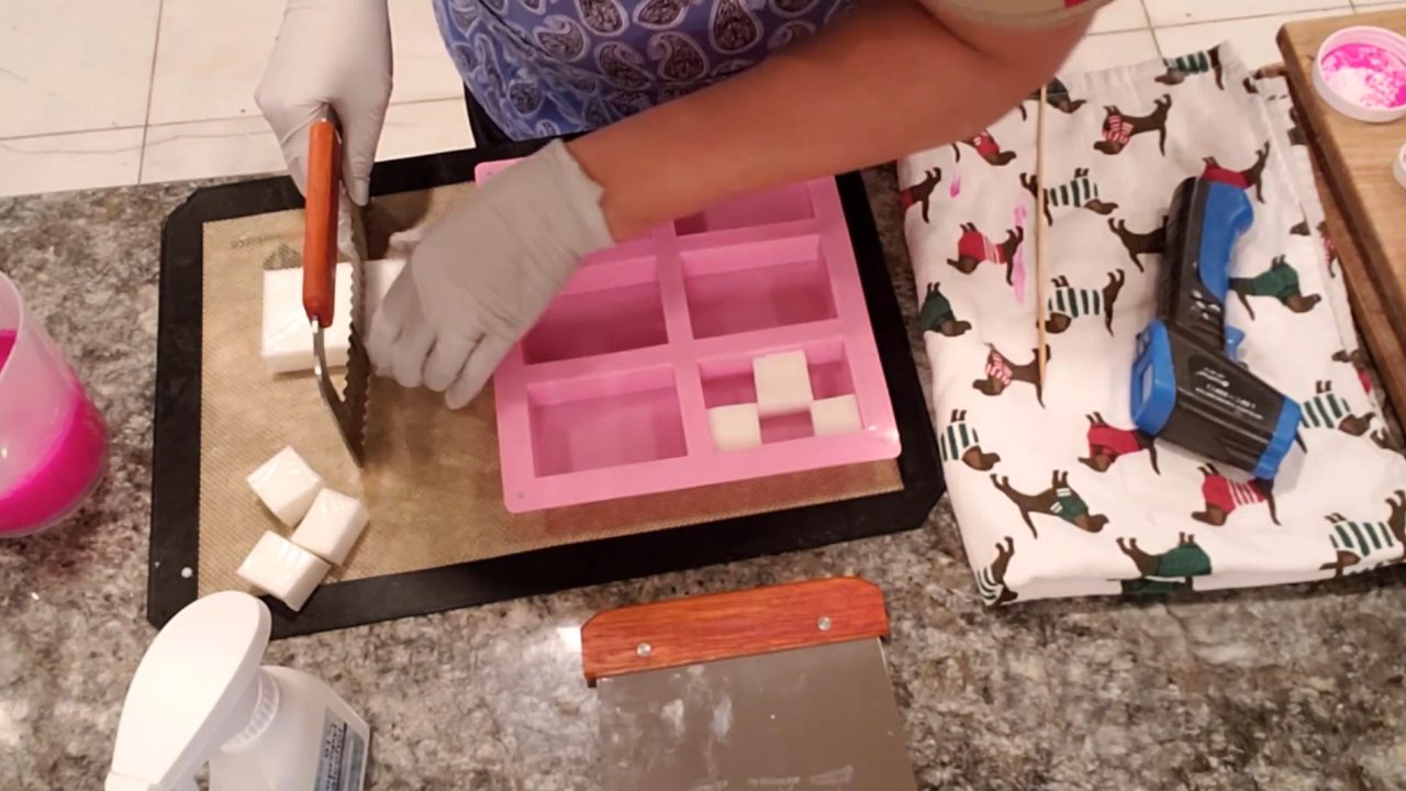 Cutting soap pieces with a wavy cutter for a checkered soap