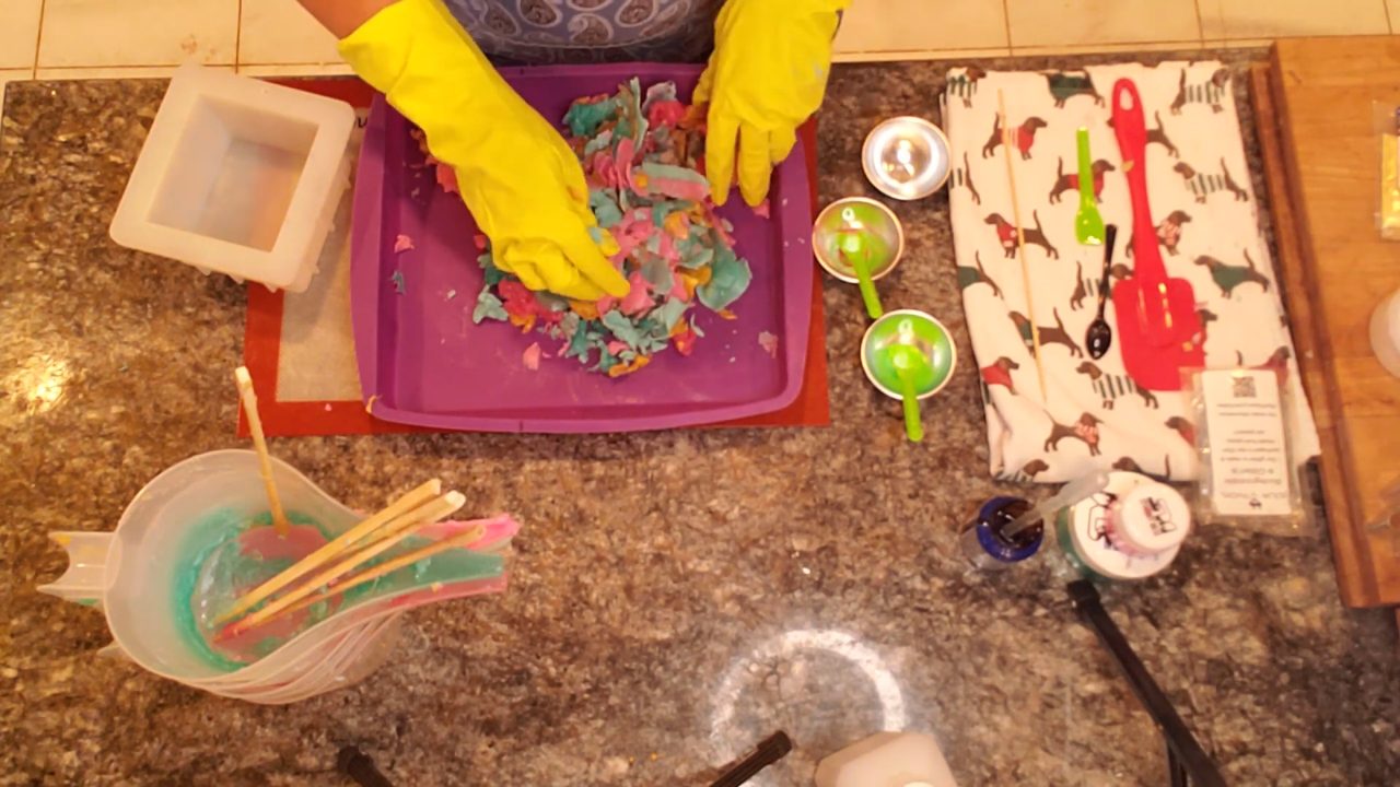 Mashing the colorful soap layers into a ball