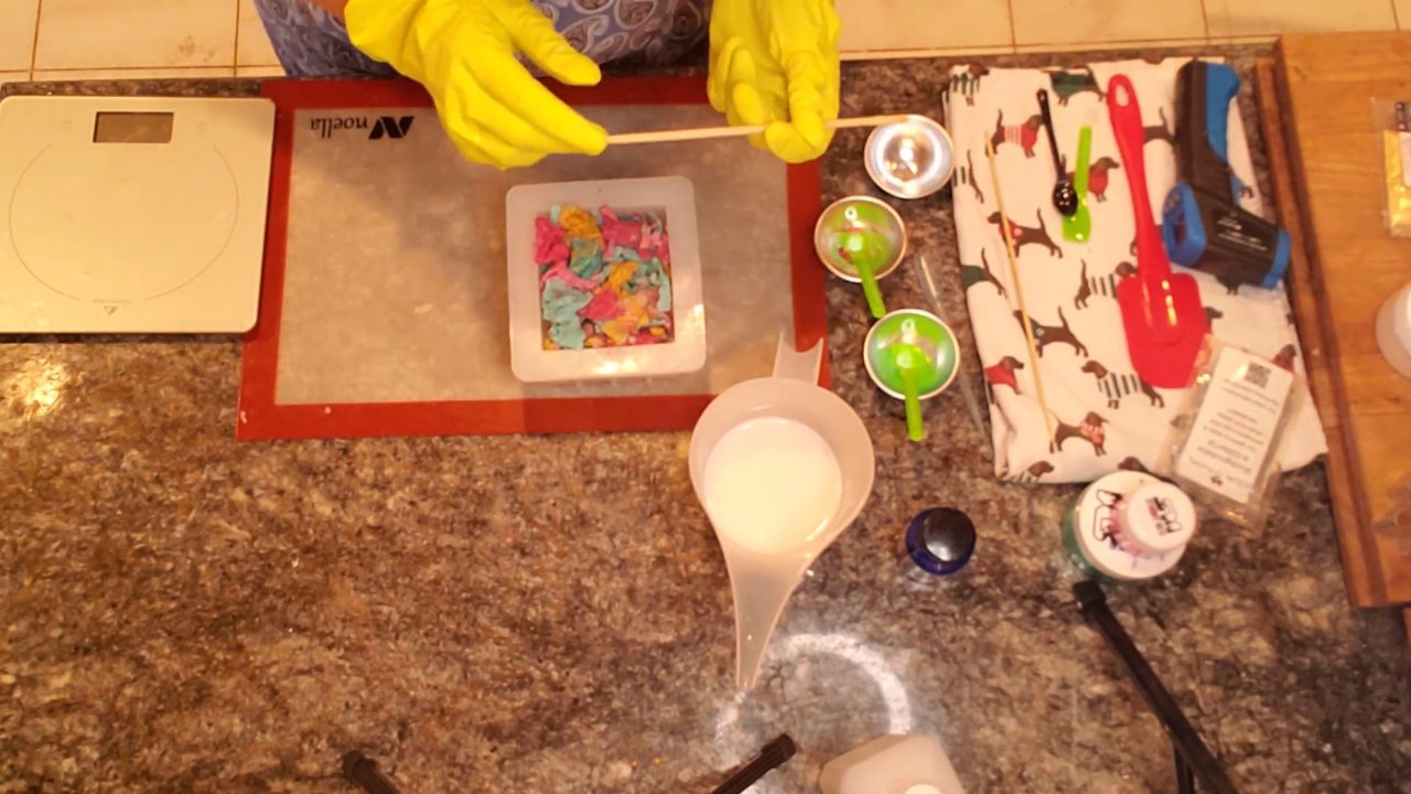 Poking holes in the soap before pouring hot shea butter