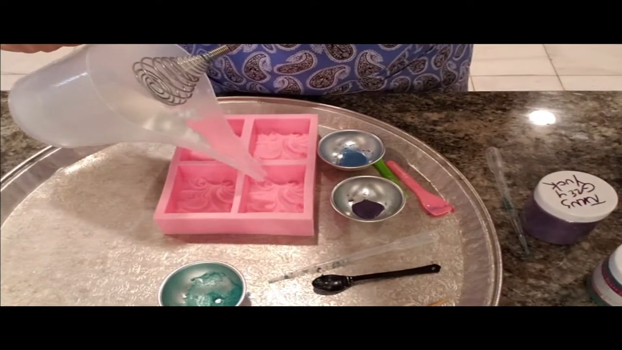 Adding green mica color to the soap in the cloud wave mold