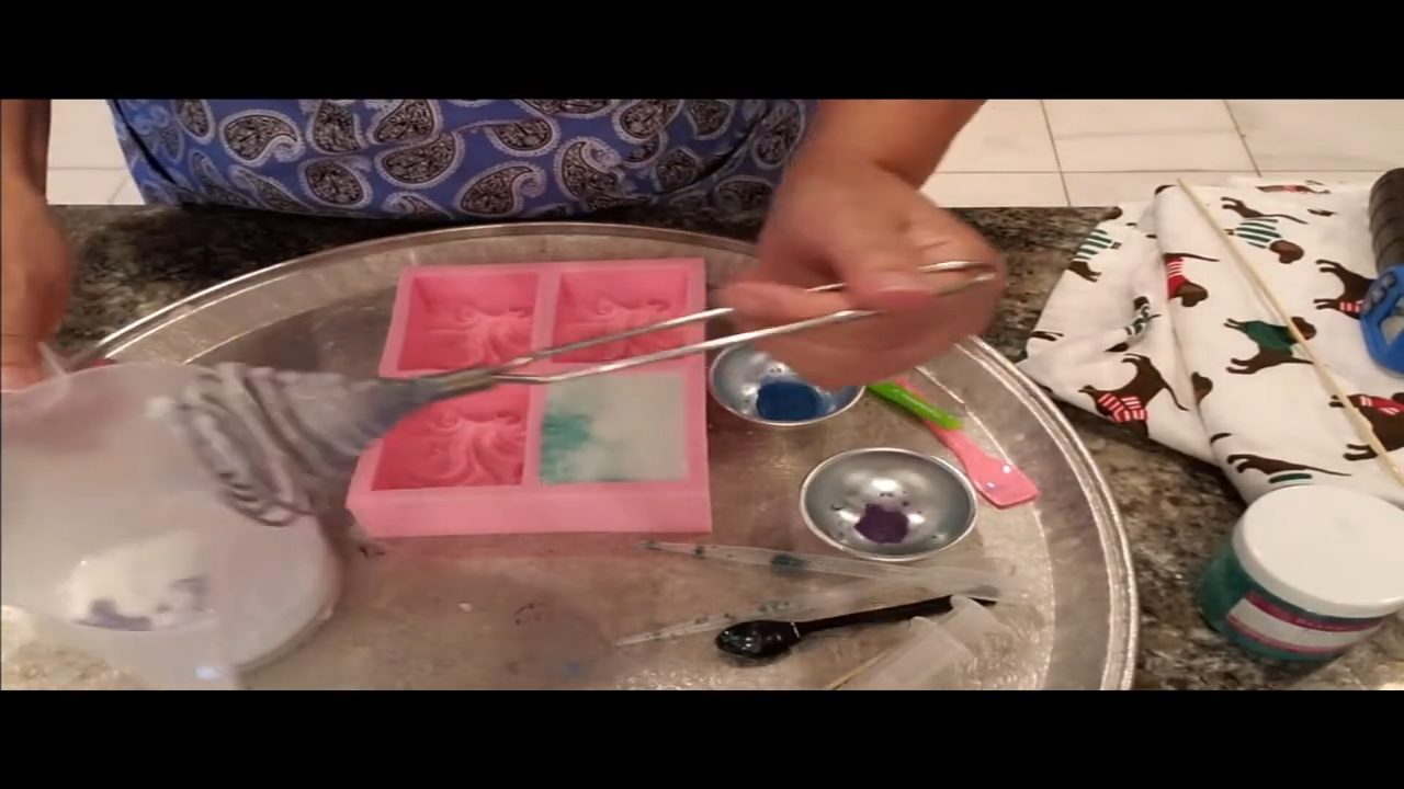 Squirting purple mica into soap with a curved dental syringe
