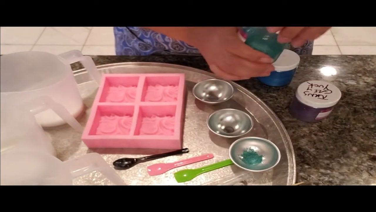 Mixing mica with distilled water in small cups for a melt and pour swirl