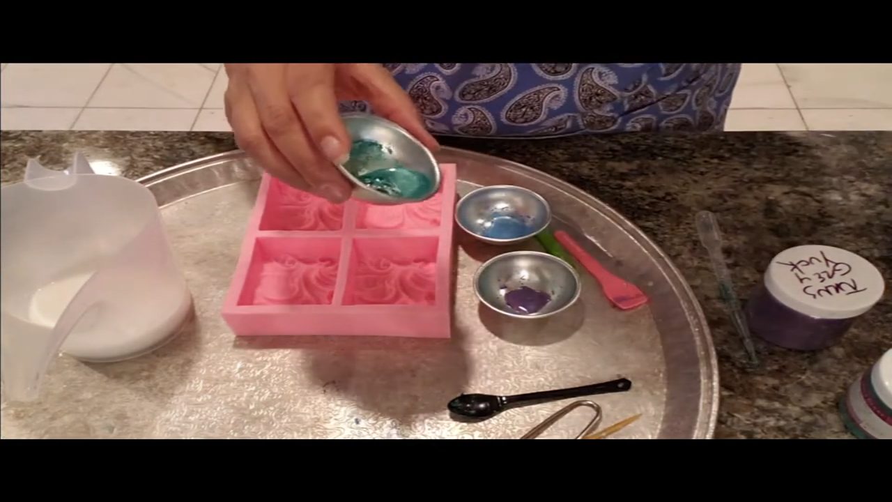 Pouring goats milk melt and pour soap into a cloud wave silicone mold