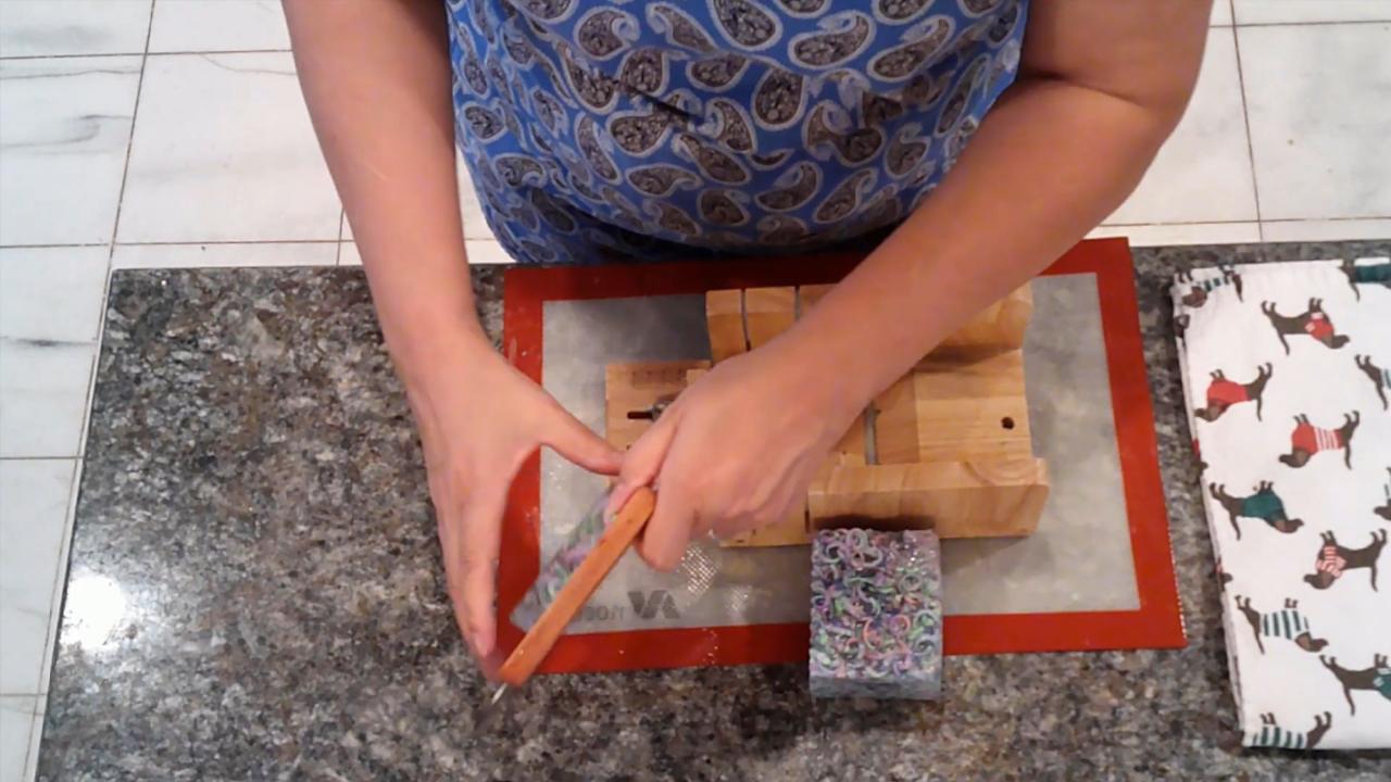 Cutting the clear confetti soap into bars