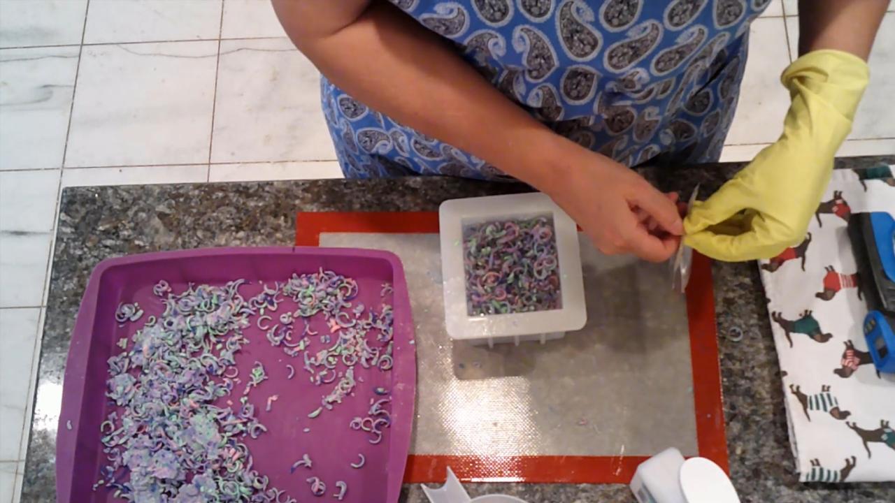 Square mold filled with confetti in clear soap