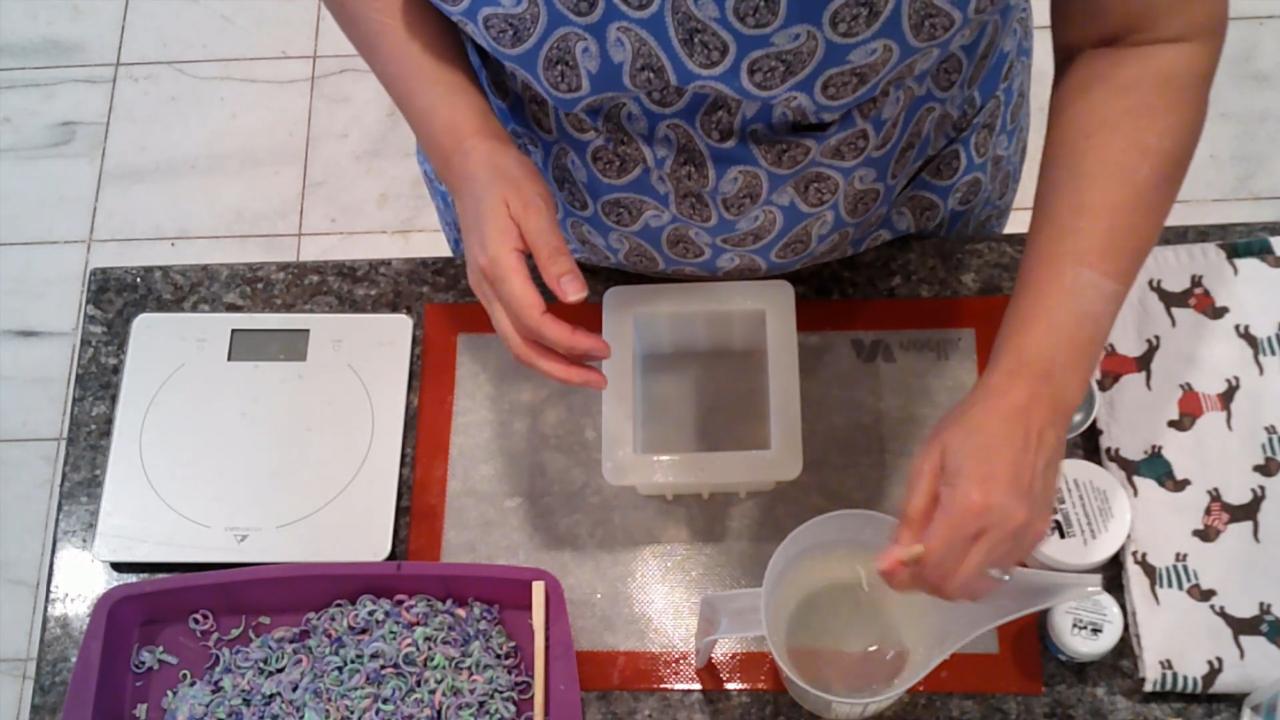 Pouring clear melt and pour soap into the mold