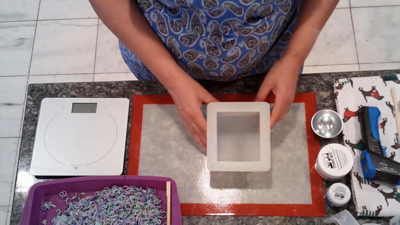 Tray of shredded soap confetti and a square mold