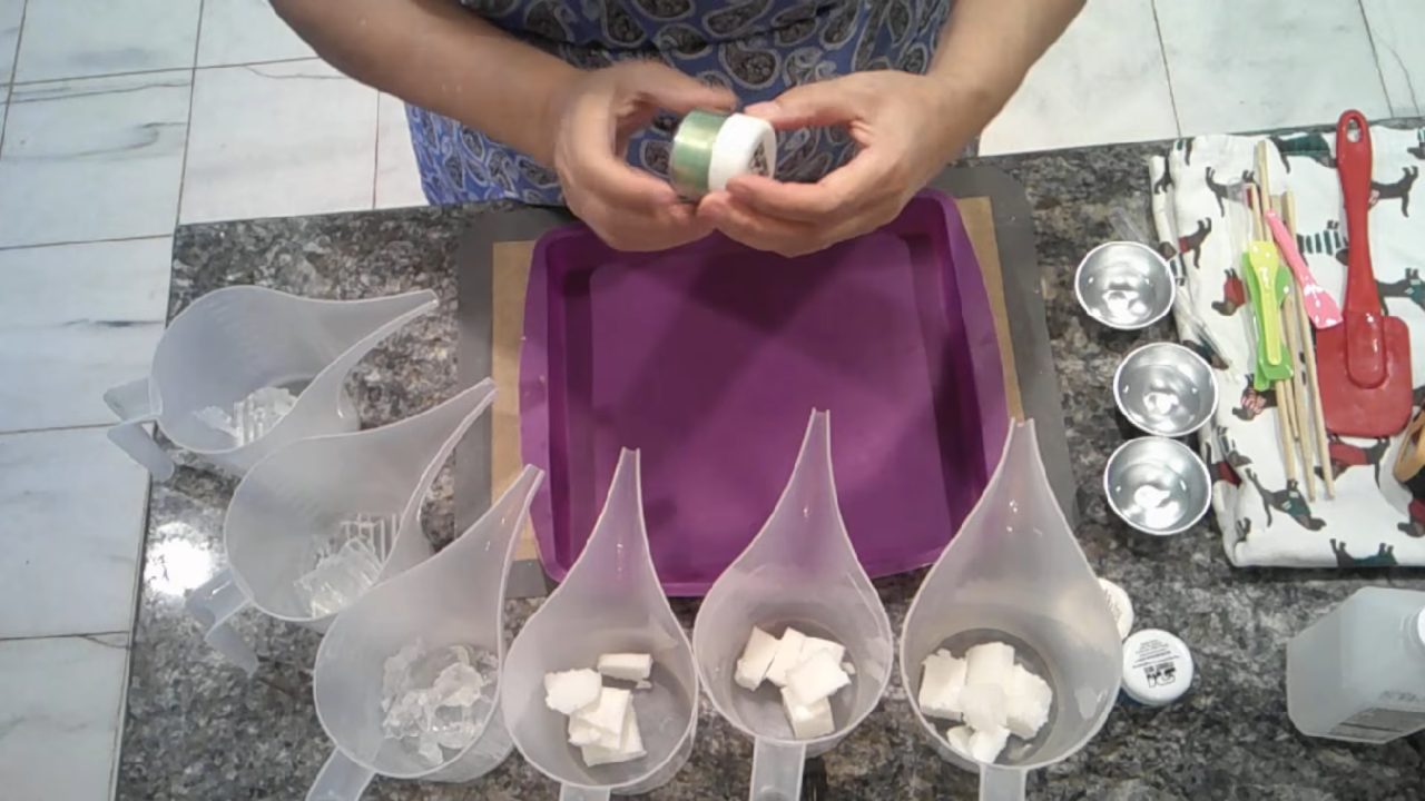 Melted shea butter and clear soap in pour cups ready for mica colors