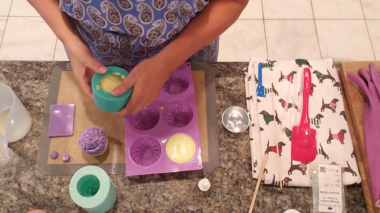 Unmolded purple and yellow cupcake soaps