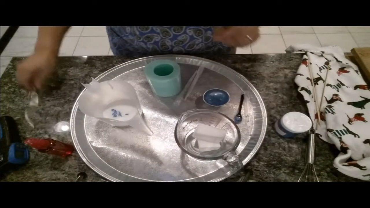 Twisting a coil whisk once to swirl the blue color