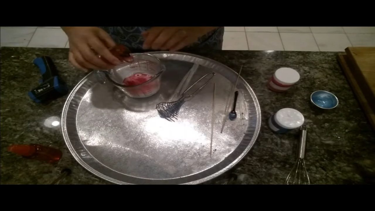 Mixing pink mica into soap for the cupcake base
