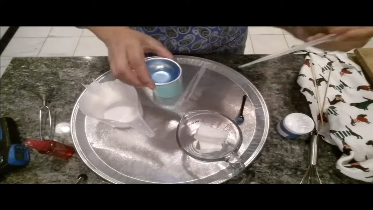 Squirting blue color into thickened soap