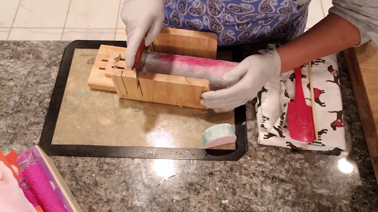 Cutting the curved top soap loaf into bars