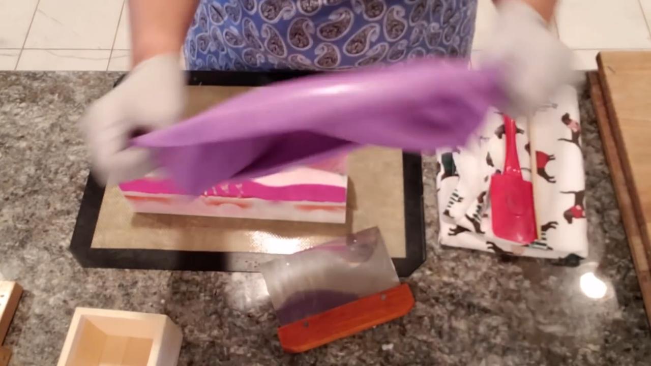 Lifting the curved soap loaf out of the mold