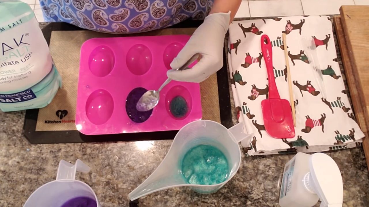 Stirring Epsom salt and soap together in the mold