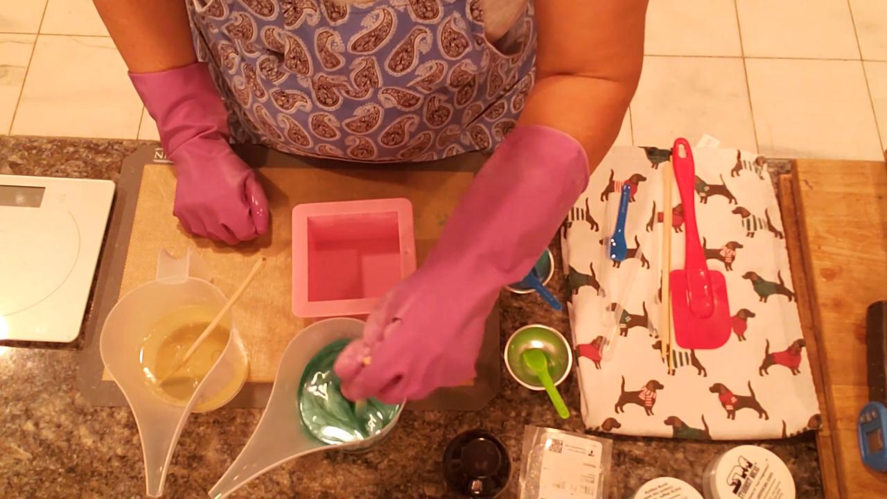 Mixing teal green mica into melted soap