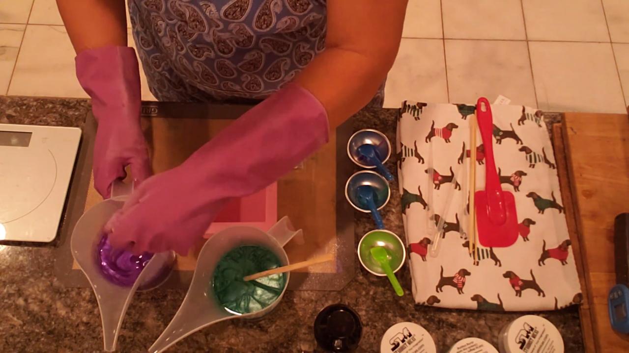 Mixing violet mica and bio glitter into clear soap