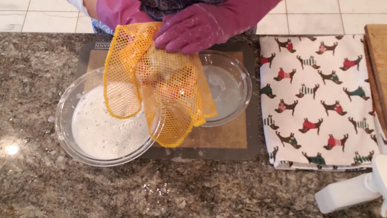 Rinsing the felted soap in cold water and squeezing out suds