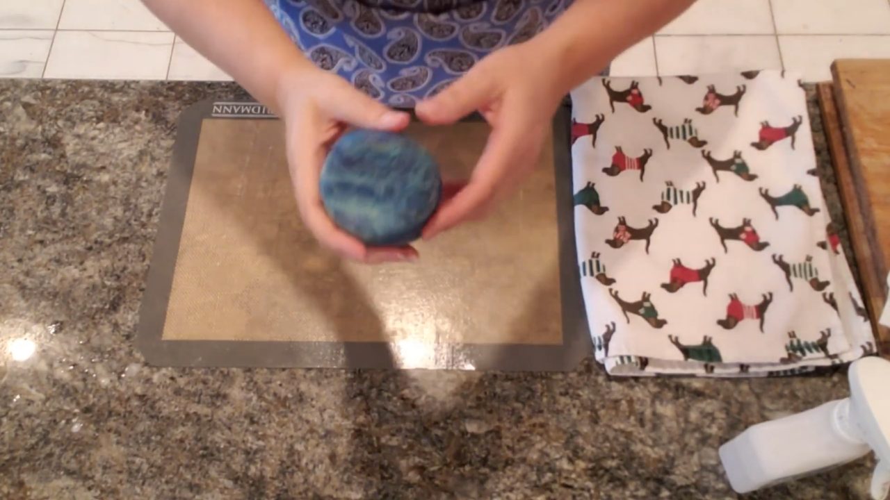 Finished felted soap bar wrapped in blue wool