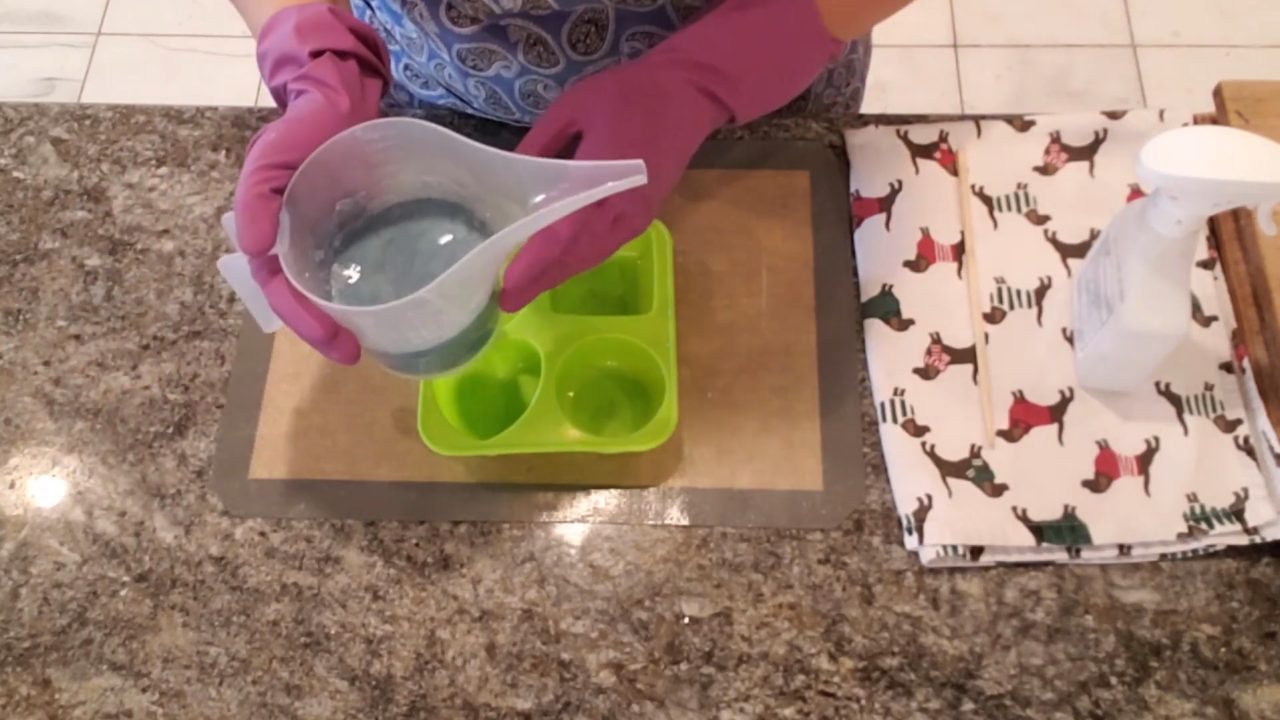 Pouring melt and pour soap into a large round silicone mold for felting
