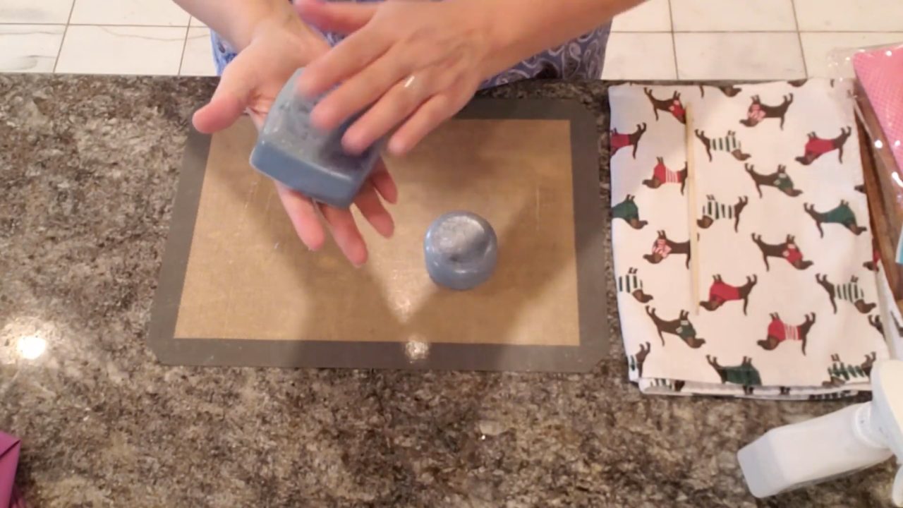 Unmolded round soap bar ready to be felted