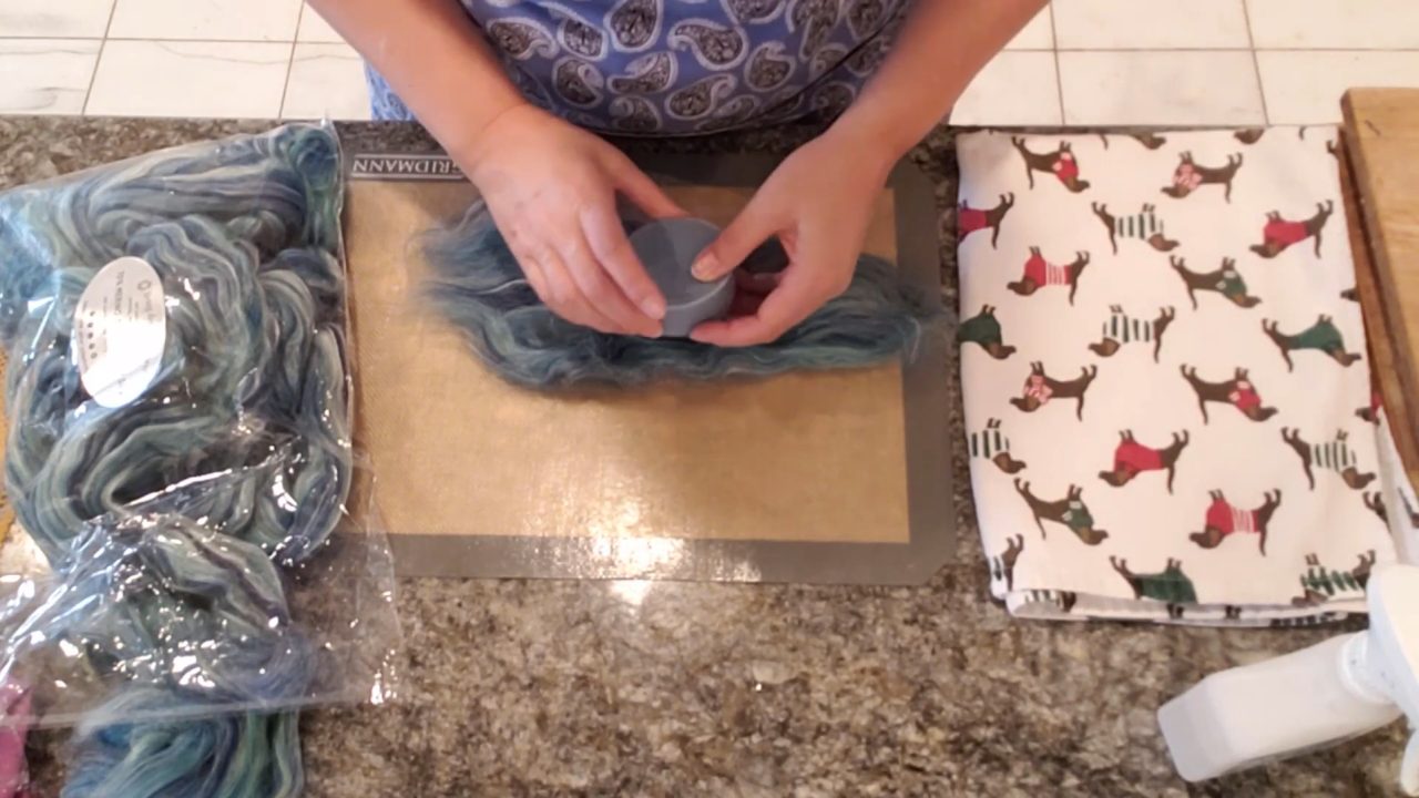 Wrapping a soap bar in wool roving like a gift