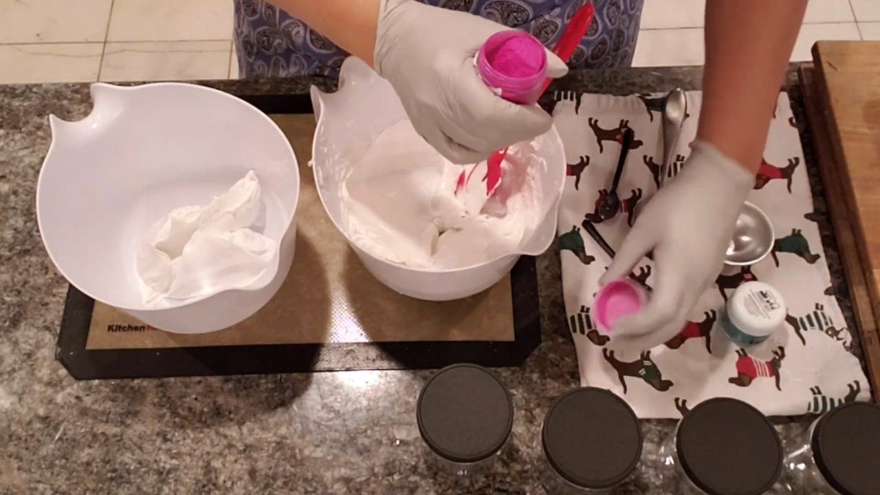 Folding pink mica into whipped foaming bath butter
