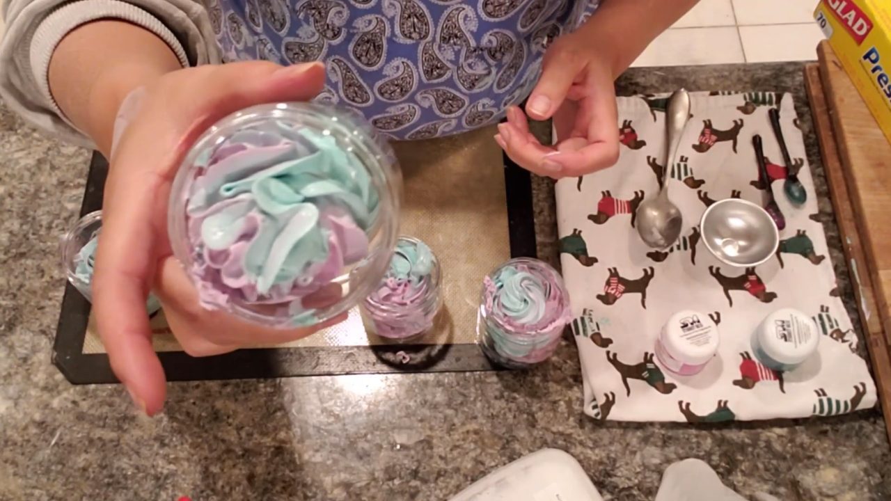 Jar of pink, green and white whipped foaming bath butter