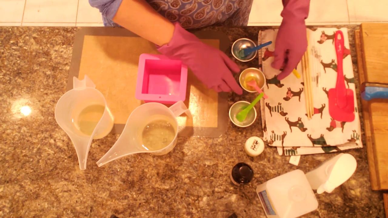 Adding mica to cups for the yellow and green soap