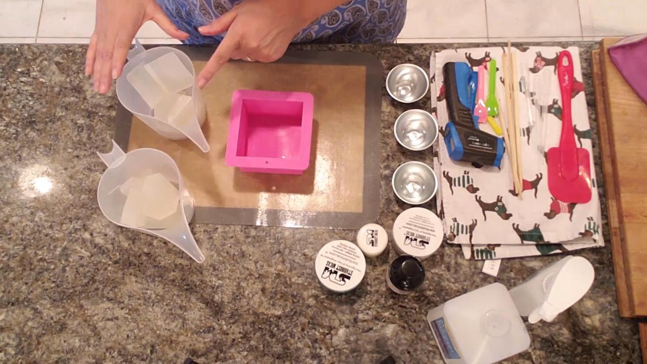 Melted clear soap base and a square mold